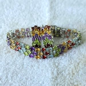 Sterling silver and precious stones bracelet and earrings set.